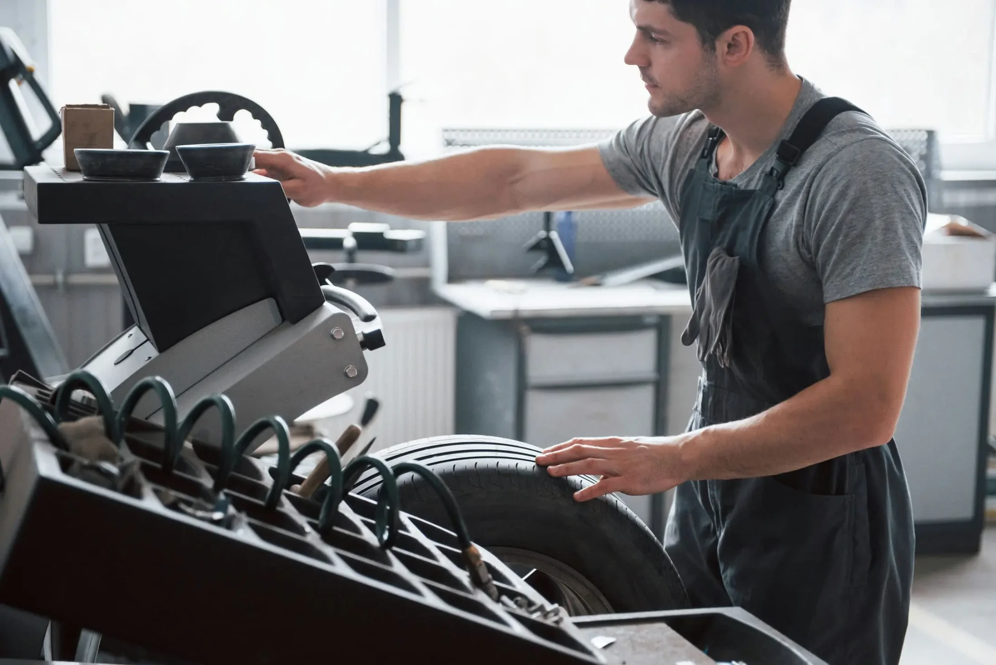 changing-parameters-young-man-works-with-wheel-s-2026-03-24-03-18-52-utc